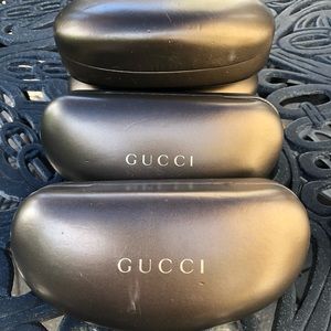 Assorted hard side cases for Gucci sunglasses